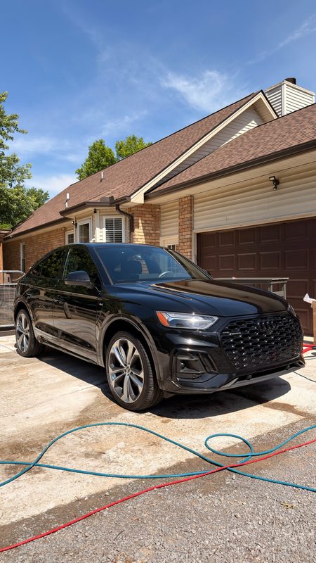 Black Audi Q5 during a mobile detail in a Hendersonville driveway