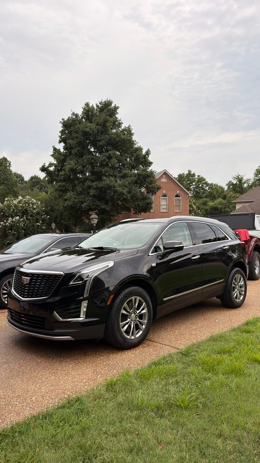 Black Cadillac XT5 gleaming after a detail by Hitchcock Detailing