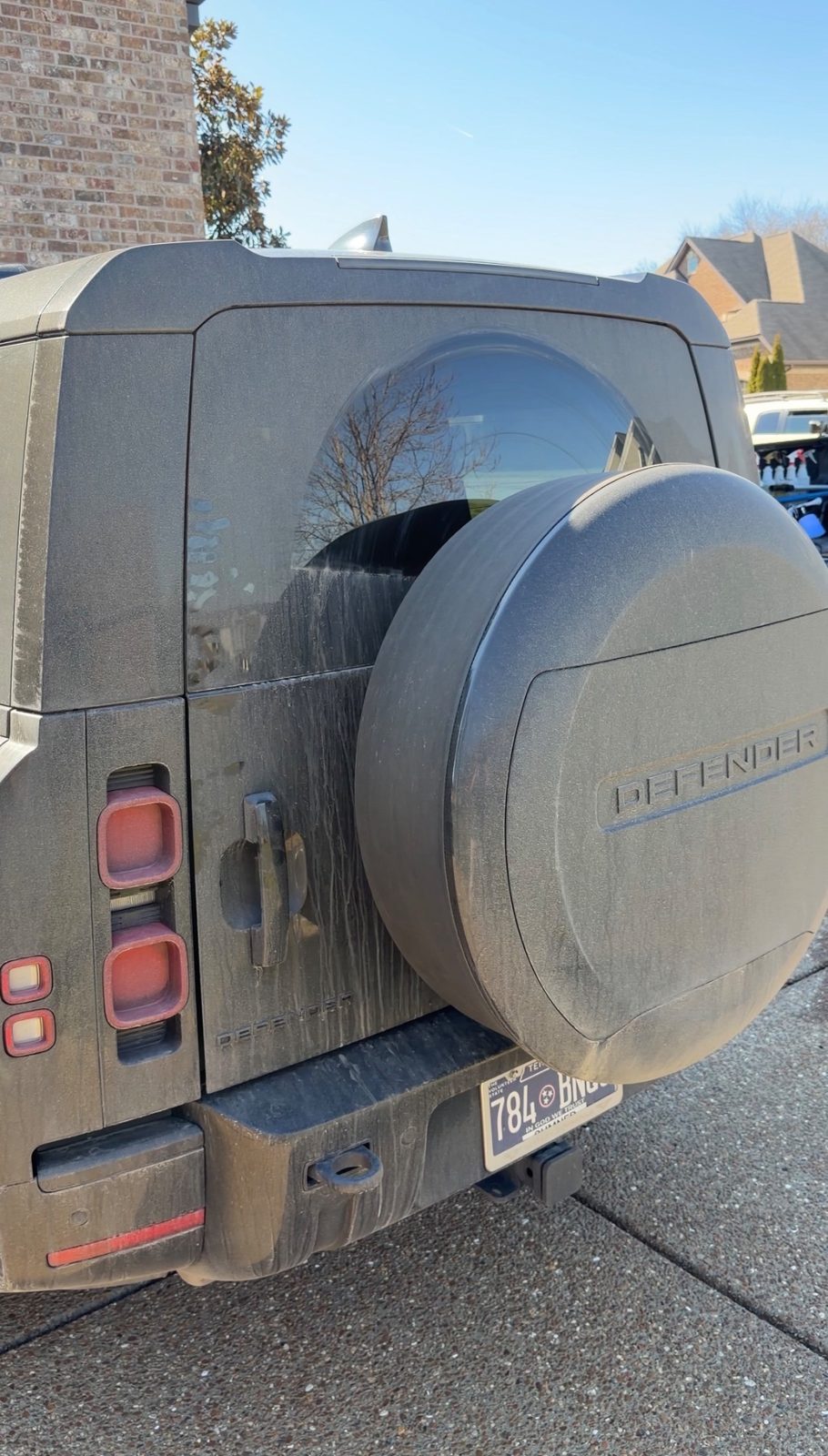 Land Rover Defender rear exterior before detailing — dirty, oxidized paint