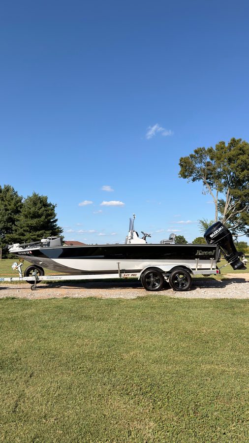 Excel bay boat on its trailer after a full detail