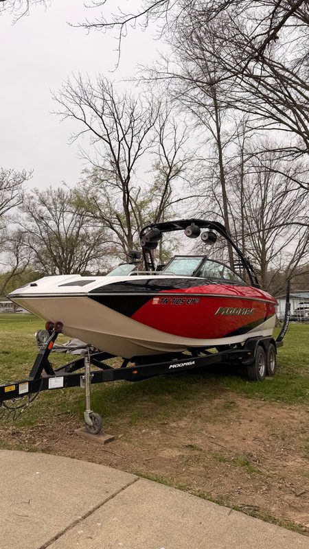 Ski boat after detailing, on its trailer